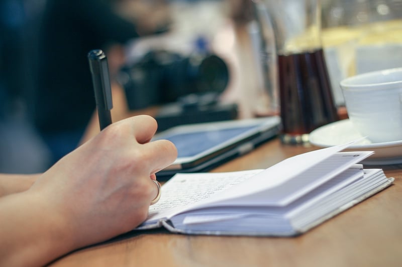 Open notebook with pen